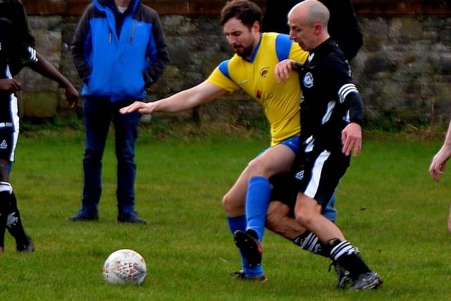 Ancrum's Craig Wood taking on Gala Hotspur's Keith McAulay during the visitors' 2-1 win at Galashiels Public Park on Saturday (Pic: Alwyn Johnston)