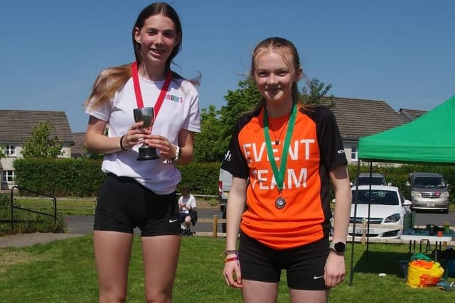 Kirsty Rankine, winner of St Boswells village race's class for girls aged 12 to 15, with runner-up Emily Tweddle