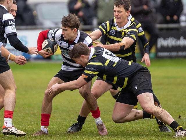 Archie Barbour on the ball for Kelso, with Gavin Wood and Craig Fairbairn challenging, as they beat Melrose 39-22 at home at Poynder Park on Saturday (Photo: Andy McLean)