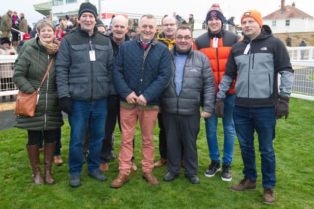 Selkirk racehorse trainer Stuart Coltherd, centre, celebrating with the owners of Grand Voyage, the Shire Dreamers syndicate, after winning the George and Margaret Failte Air Ais Comharrahadh Novices' Handicap Hurdle at Kelso yesterday (Photo: Bill McBurnie)