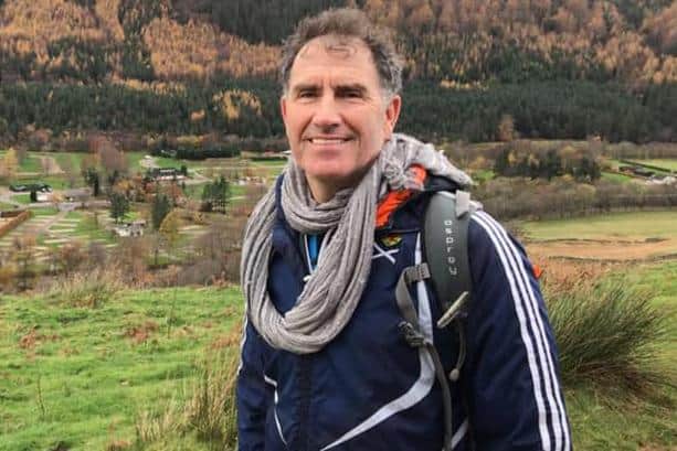 Gala Fairydean Rovers committee member Norrie Collins on his way up Ben Nevis to help raise funds for an op appeal for their defender Ben Herdman (Photo: John Collins)