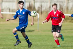 Jack Oliver, in blue, in action for Selkirk Victoria against Kelso Thistle (Photo: Bill McBurnie)
