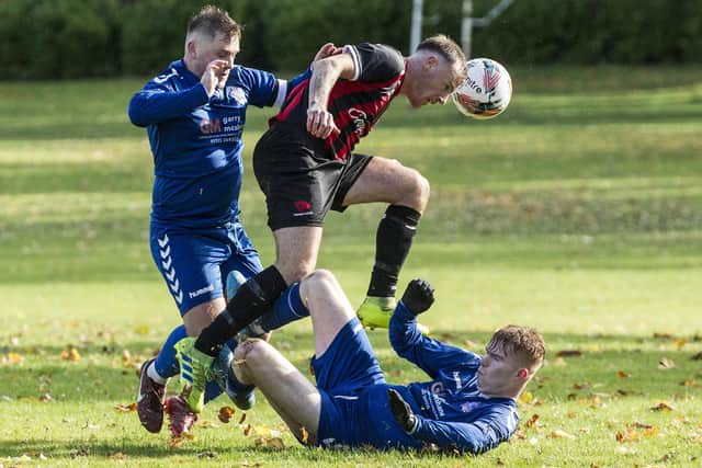Liam Lavery winning a header for Hawick Colts against Selkirk Victoria at the weekend (Pic: Bill McBurnie)