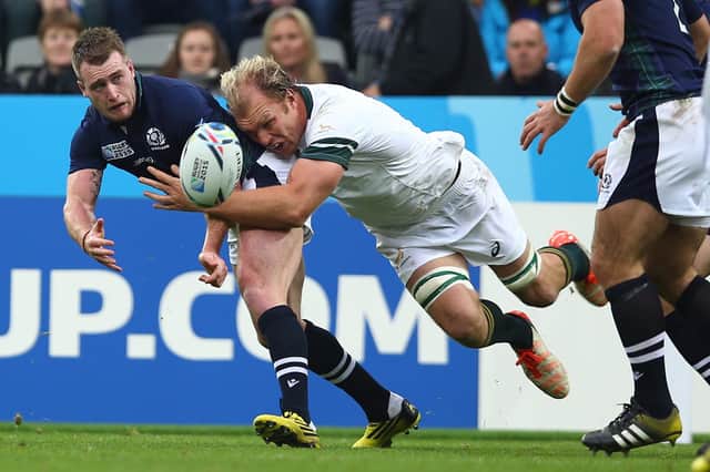 Scotland's Stuart Hogg being tackled by Schalk Burger of South Africa during their 2015 Rugby World Cup pool B match at St James's Park in Newcastle on October 3, 2015. (Photo by Steve Haag/Gallo Images)