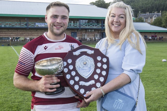 Helen Collins presenting the trophy for player of the tournament to Stu Allison of winners Watsonians