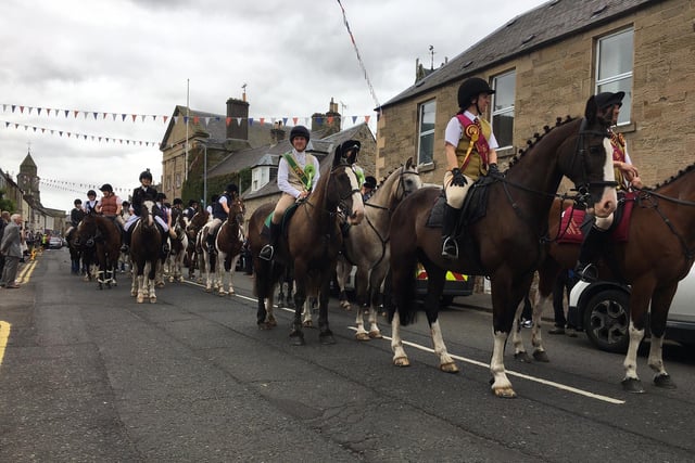 The cavalcade makes its way along Coldstream high street.