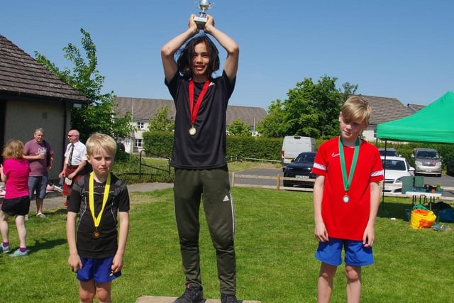 St Boswells Village Week two-mile race winners in its class for boys aged eight to 11 - first-placed Jinyong Gulvin, runner-up Caleb Entwistle and third-placed Fraser Dale