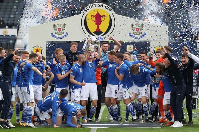 St Johnstone captain Jason Kerr lifts the trophy following the Scottish Cup final against Hibernian won by his side at Glasgow's Hampden Park on May 22 (Photo by Ian MacNicol/Getty Images)