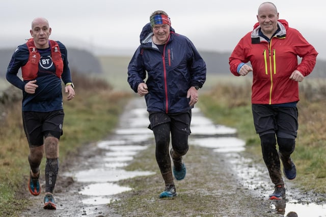 Three men taking part in Lauderdale Limpers and Gala Harriers' social run from Tweedbank to Lauder on Tuesday