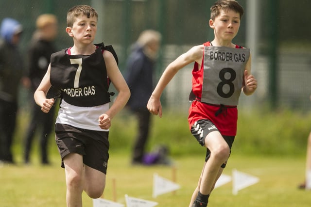 Teviotdale Harrier James Wood, left, competing in the youths' 800m handicap alongside Kelso's Leo Tait
