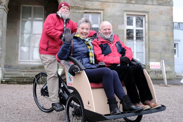 Pilot Jim McPherson with passengers Jim and Shiela Johnston from the EnergiseGala group, which has fundraised to provide a similar trishaw in Galashiels.  Photo: Rob Gray.