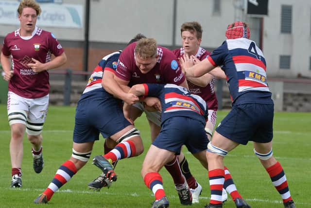 Aberdeen Grammar go mob-handed to try to halt a charge by Gala's Marius Tamosaitis (Photo: Alwyn Johnston)