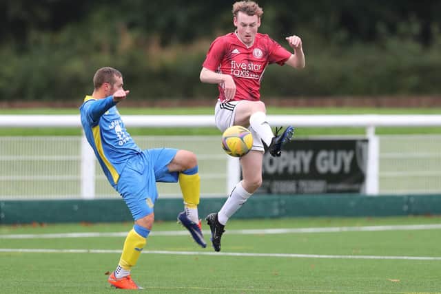 Gala Fairydean Rovers Amateurs' Kai Macrae and Eyemouth United Amateurs left-back Kev Strachan vying for the ball at Netherdale on Saturday (Photo: Brian Sutherland)