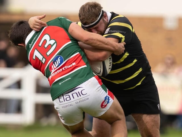 Jack Dobie on the ball for Melrose, taking on Charlie Lonergan, during their 34-31 win away to Glasgow Hutchesons’ Aloysians on Saturday (Photo: Andy McLean)