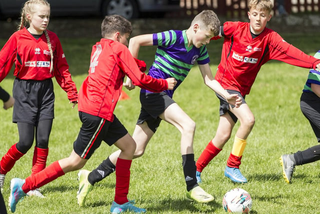 Drumlanrig St Cuthbert's Primary's Jae McCracken tracking a Wilton Primary player in the John Slorance Cup's final