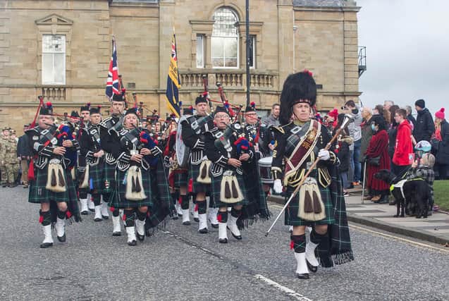 Jedburgh Pipe Band lead the parade towards the war memorial. (Photo: BILL McBURNIE)