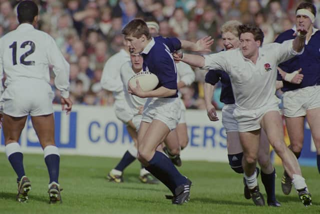 Hawick's Tony Stanger getting away from England's Mike Teague during the hosts' 13-7 victory in 1990 (Photo by Getty Images)