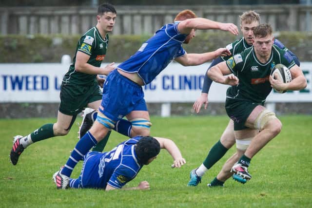 Hawick's Jae Linton evades a challenge from Jed-Forest's Gregor Law, supported by Kyle Brunton (Pic: Bill McBurnie)