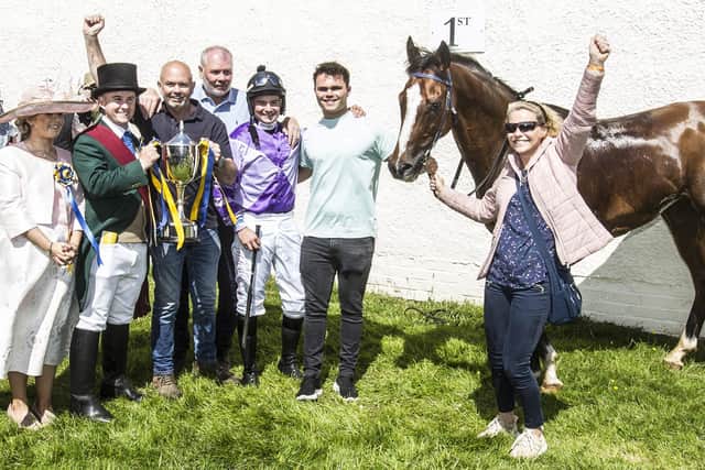 Handsome Harry, winner of the 136th Tradesmen's Emtelle Handicap at Hawick last Friday, with Hawick Cornet Greig Middlemass and lass Emma Gibson, owner Neil Henderson, brother John, jockey Dale Irving and Neil's son Callum and his wife Jackie (Photo: Bill McBurnie)