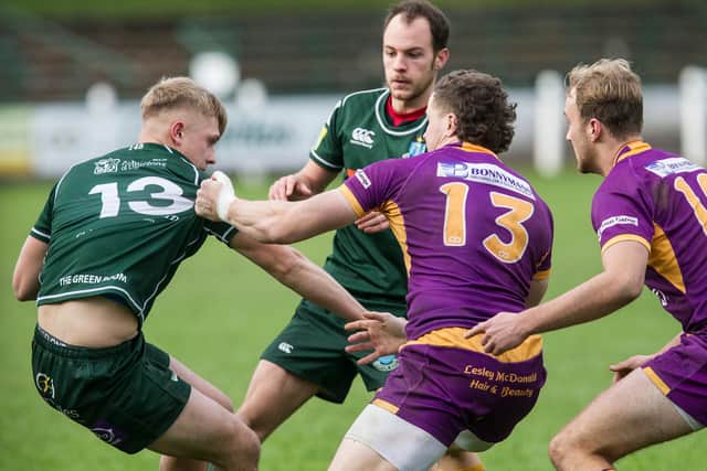 Hawick outside centre Logan Gordon-Woolley coming up against his opposite for Marr, Scott Bickerstaff (Photo: Bill McBurnie)
