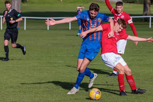 Peebles Rovers and Hawick Royal Albert vying for possession during their 2-2 draw on Saturday (Pic: Pete Birrell)