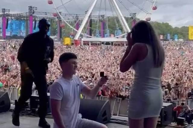 Myles went on one knee to propose to Indy, with Yung Filly and the huge crowd looking on.