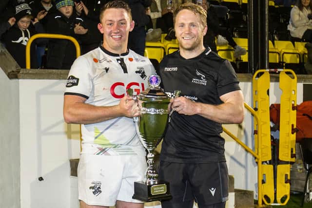 Southern Knights captain Russell Anderson being handed Doddie's Club Trophy by Newcastle Falcons skipper Alex Tait (Photo: Bill McBurnie)