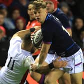 Darcy Graham going past Joe Marchant during the Six Nations match between Scotland and England at Edinburgh's Murrayfield Stadium yesterday (Photo by David Rogers/Getty Images)