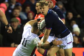 Darcy Graham going past Joe Marchant during the Six Nations match between Scotland and England at Edinburgh's Murrayfield Stadium yesterday (Photo by David Rogers/Getty Images)
