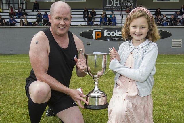 Robyn McNulty presenting the 100m open trophy to Rosyth's Jack Beattie at Kelso Border Games on Sunday