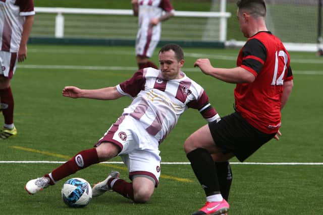 Ryan Grant helping Langlee Amateurs beat Lanark’s Kirkfield United 4-1 in this year’s South of Scotland Amateur Cup semi-finals at Netherdale in Galashiels on Saturday (Photo: Steve Cox)