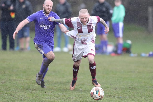Jack Hay being held back during Langlee Amateurs' 7-0 win at home to Hawick Waverley in the Border Amateur Football Association's A division on Saturday (Pic: Brian Sutherland)
