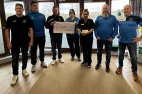 Earlston Rhymers handing over £3,000 raised by a sponsored walk in November to the Melburn Lodge specialist dementia unit at the Borders General Hospital at Melrose (Pic: Earlston Rhymers)