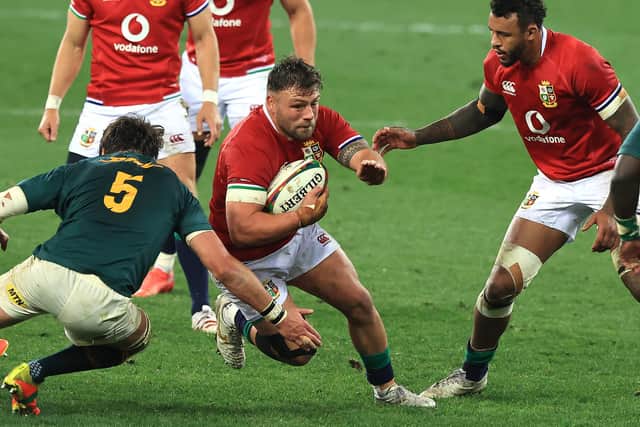Rory Sutherland being tackled by Franco Mostert during the test match between South Africa and the British and Irish Lions in Cape Town yesterday (Photo by David Rogers/Getty Images)
