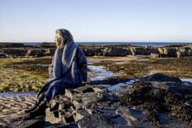 Award-winning textile artist Karen Charlton wearing coat she created.