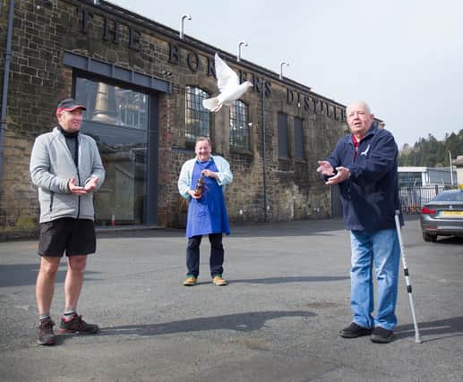 Borders Distillery founder and director John Fordyce, releases a pigeon with racing federation joint secretary Harry Keddie and president Mike Upton (picture by Bill McBurnie)