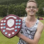 Hawick's Thomas MacAskill with one of the two trophies he won at 2022's Peebles Border Games (Pic: Bill McBurnie)