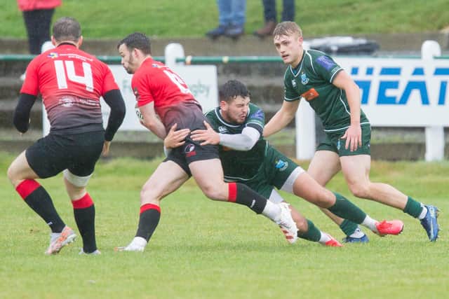 Hawick's Bailey Donaldson making a tackle against Glasgow Hawks, with Logan Gordon-Wooley supporting (Photo: Bill McBurnie)