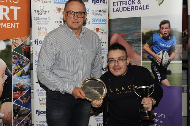 Daniel Porter being presented with his Club Sport Ettrick and Lauderdale award for disability sport by David Boland