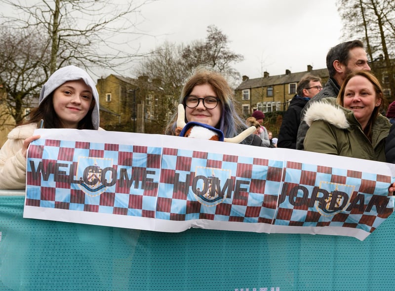 Youngsters with a banner welcoming home Jordan North from his 100 mile rowing challenge in aid of Comic Relief. Photo: Kelvin Stuttard
