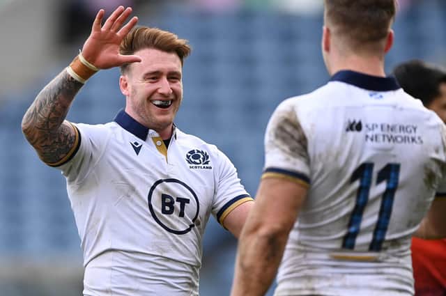 Stuart Hogg congratulates team-mate Duhan van der Merwe after the latter scored their side's eighth try during the Guinness Six Nations match between Scotland and Italy at Murrayfield today in Edinburgh (Photo by Stu Forster/Getty Images)