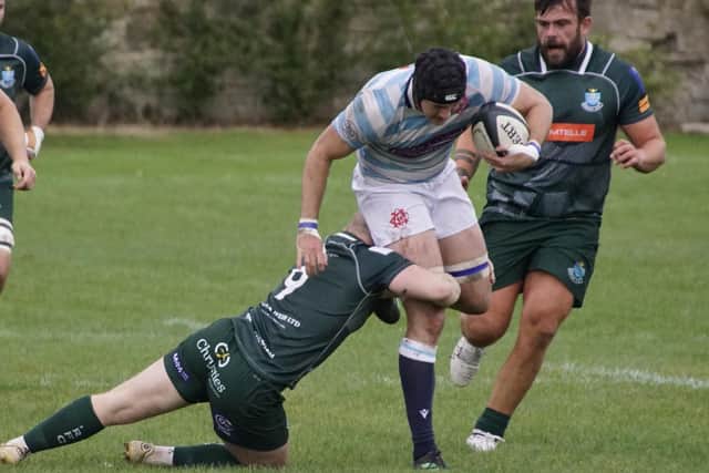 Gareth Welsh, supported by captain Shawn Muir, putting a tackle in for Hawick as they beat Edinburgh Academical 20-15 away on Saturday (Photo: John Wright)