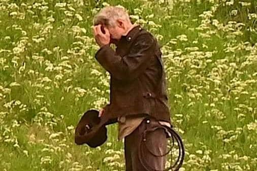 Harrison Ford, as Indiana Jones, looks as though he's fighting Borders midges in his new film, shooting at Leaderfoot Viaduct last night. Photo: Neil Renton.