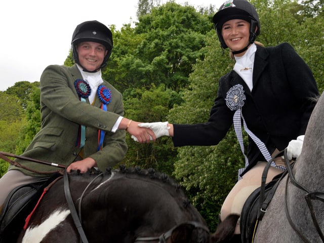 Standard Bearer Nichol shakes Braw Lass Abbie's hand.