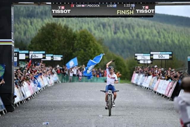 Great Britain's Tom Pidcock celebrating winning gold in the men's elite cross-country Olympic mountain bike race during the inaugural UCI world championships at Glentress Forest on Saturday (Photo by Oli Scarff/AFP via Getty Images)