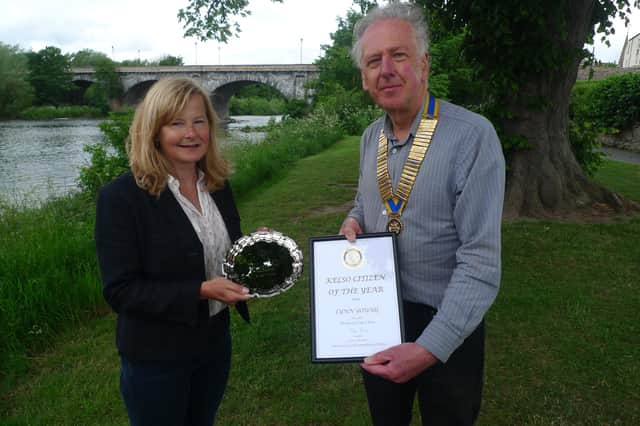 Lynn Young is presented with her award by Kelso Rotary Club president Ian Ross.