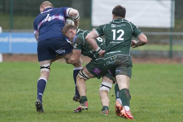 Hawick's Jae Linton stopping a charge by Selkirk's James Head on Saturday (Pic: Bill McBurnie)