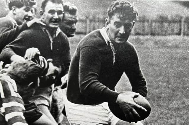 Oliver Grant playing for Hawick, with his friend Hugh McLeod looking on