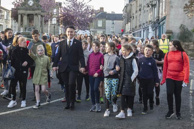 2022 Hawick Cornet Greig Middlemass leads the Cornet's Walk around the town following his election as Cornet. Photo: Bill McBurnie.