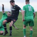 Craig Anderson putting a tackle in during Greenlaw's 3-2 Border Amateur Football Association A division win at Chirnside United on Saturday ahead of a South of Scotland Amateur Cup tie at home to lauder this weekend (Photo: Brian Sutherland)